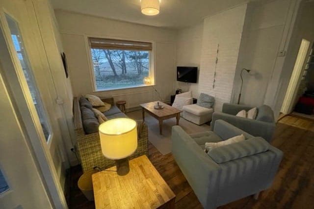 Sfeervolle woonkamer vakantiehuis Duinhuis Midsland Noord Terschelling — verhuur